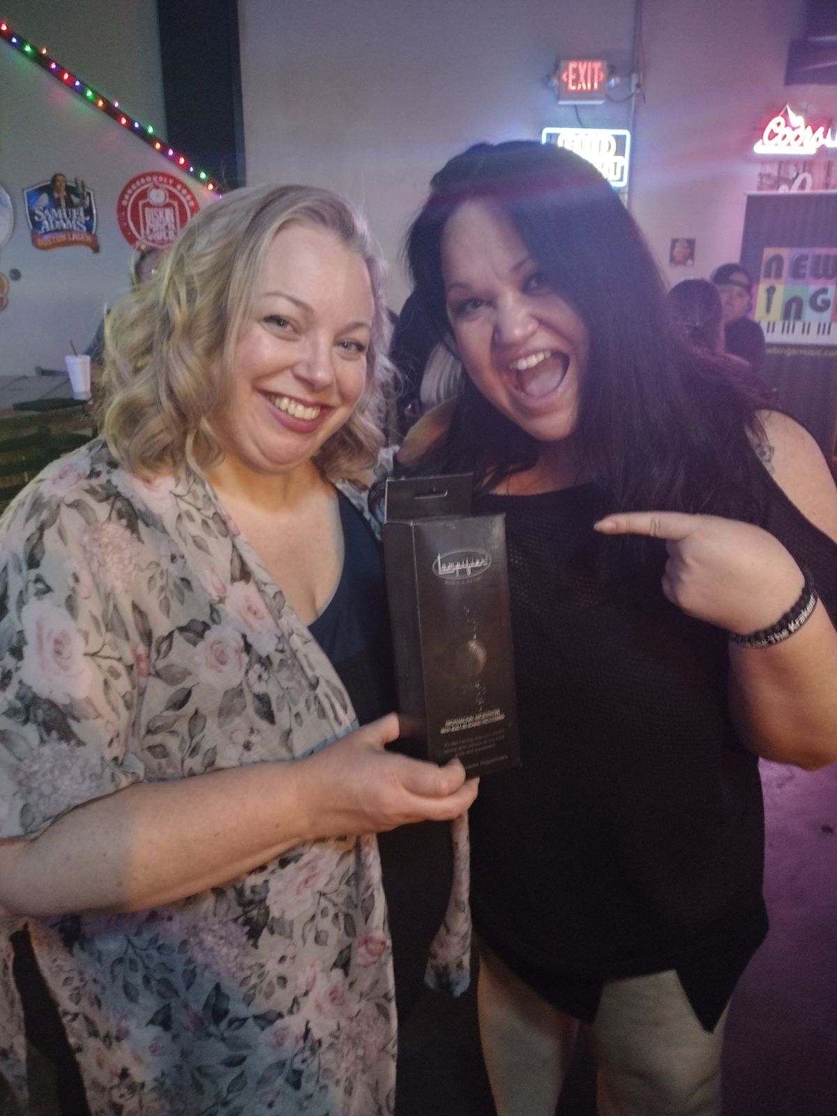 Image of New Binge’s, Barb and Alicia holding just purchased container of Lampifier Programmable 